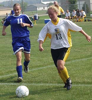 JC boys win, girls lose at SA (09/15/03)
