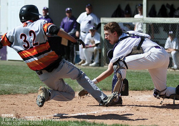 Tribe, Trojans split doubleheader