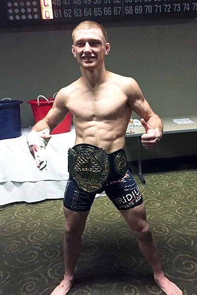 Kenney wins flyweight title