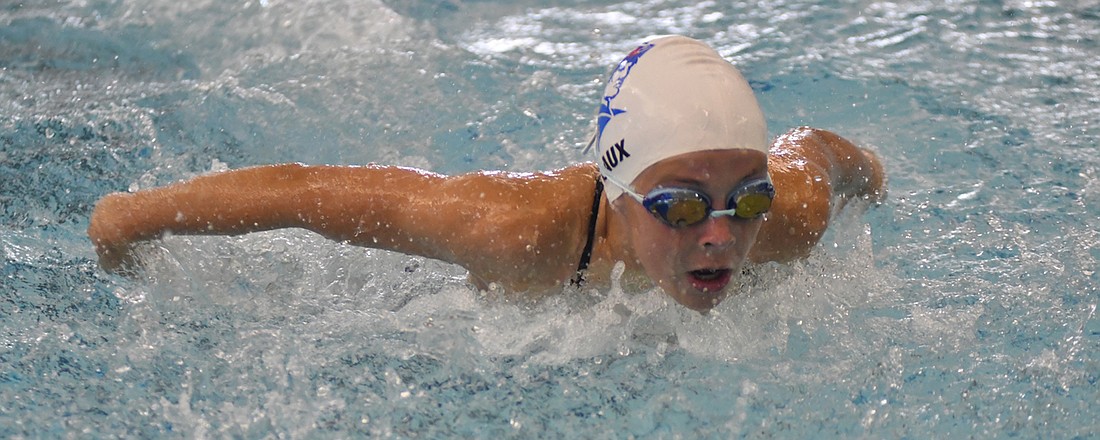 Maria Laux swims the butterfly for the Jay County Summer Swim Team’s 11-12-year-old girls medley relay team during the Wabash Valley Conference Championship on Saturday. Laux’s team which included Elly Byrum, Kenna Arnold and Kali Wendel won the race to help Jay County to a second place finish falling to Souther Wells by 423.5 points. Laux won all three of her individual events to remain perfect on the season.  (The Commercial Review/Andrew Balko)