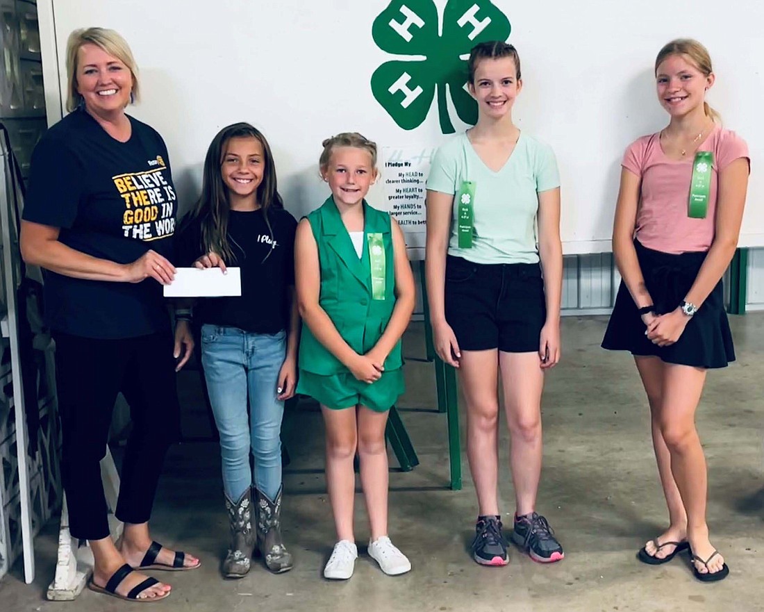 Portland Rotary Club donated $250 to Youth Service Bureau for their Born to Learn Program. Pictured are Rotary member Tracy Carpenter and 4-H members Abbie Rowles, Ivy Alt, Evelyn Carter and Abby Fifer. (Photo provided)