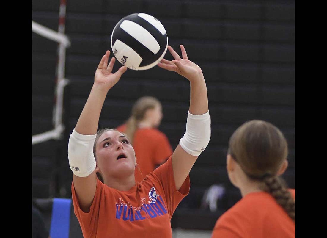 Paisley Fugiett sets a ball during the Jay County High School volleyball teamÕs scrimmage against Winchester on Thursday. The Patriots have a home scrimmage on Aug. 10 before opening their season August 14 at Madison-Grant. (The Commercial Review/Ray Cooney)