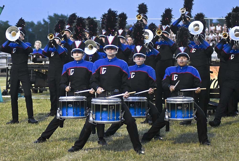 The Jay County High School Marching Patriots' snare drummers lean into their performance Saturday night during the Muncie Spirit of Sound contest at Southside Middle School. After opening with a runner-up finish at home Friday, the Marching Patriots scored 69.875 points to trail defending state champion Kokomo (74.25) and Muncie Central (73.875). Anderson (67.025) and Yorktown (61.025) rounded out the top five. (The Commercial Review/Ray Cooney)