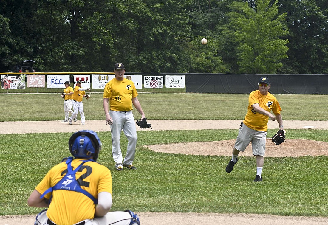 Bob Thomas, a member of the inaugural Portland Rockets team in 1959, throws out the first pitch prior to Sunday's doubleheader against the South Bend Royals at Portland Memorial Park's Runkle-Miller Field. The team played its final home games of the season Sunday. (The Commercial Review/Ray Cooney)