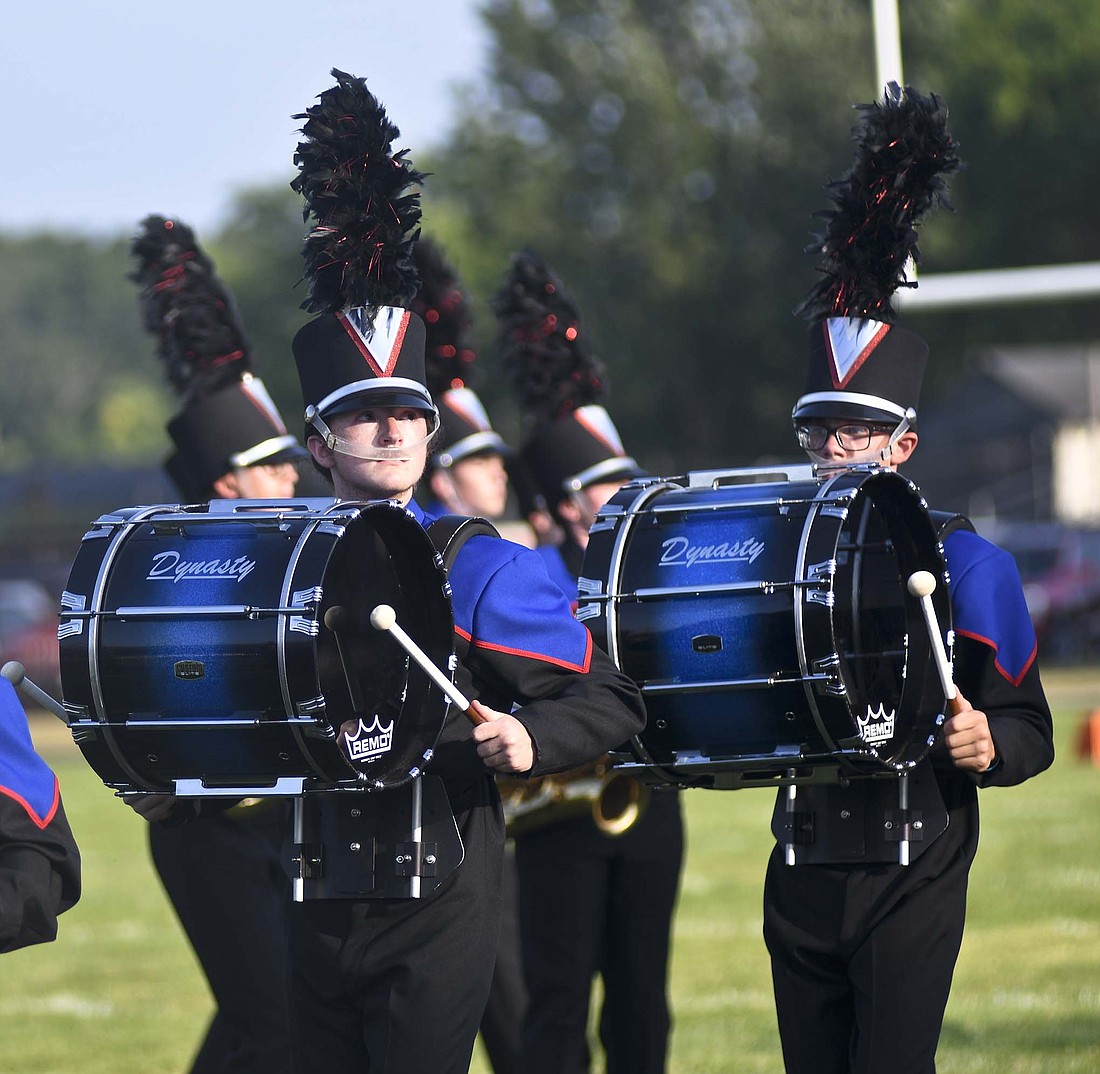 There was plenty of marching band activity Friday night as the Jay County High School Marching Patriots competed in the Anderson Tartan Tournament of Bands at Highland Middle School while Fort Recovery hosted its ice cream social and show debut. Pictured above, bass drummers Dominic Steveson and Austin Jellison perform for JCHS, which placed fifth with a score of 71.175. The Marching Patriots trailed defending state fair champion Kokomo (76.9), Muncie Central (76.85), Anderson (72.85) and Centerville (71.3). (The Commercial Review/Ray Cooney)