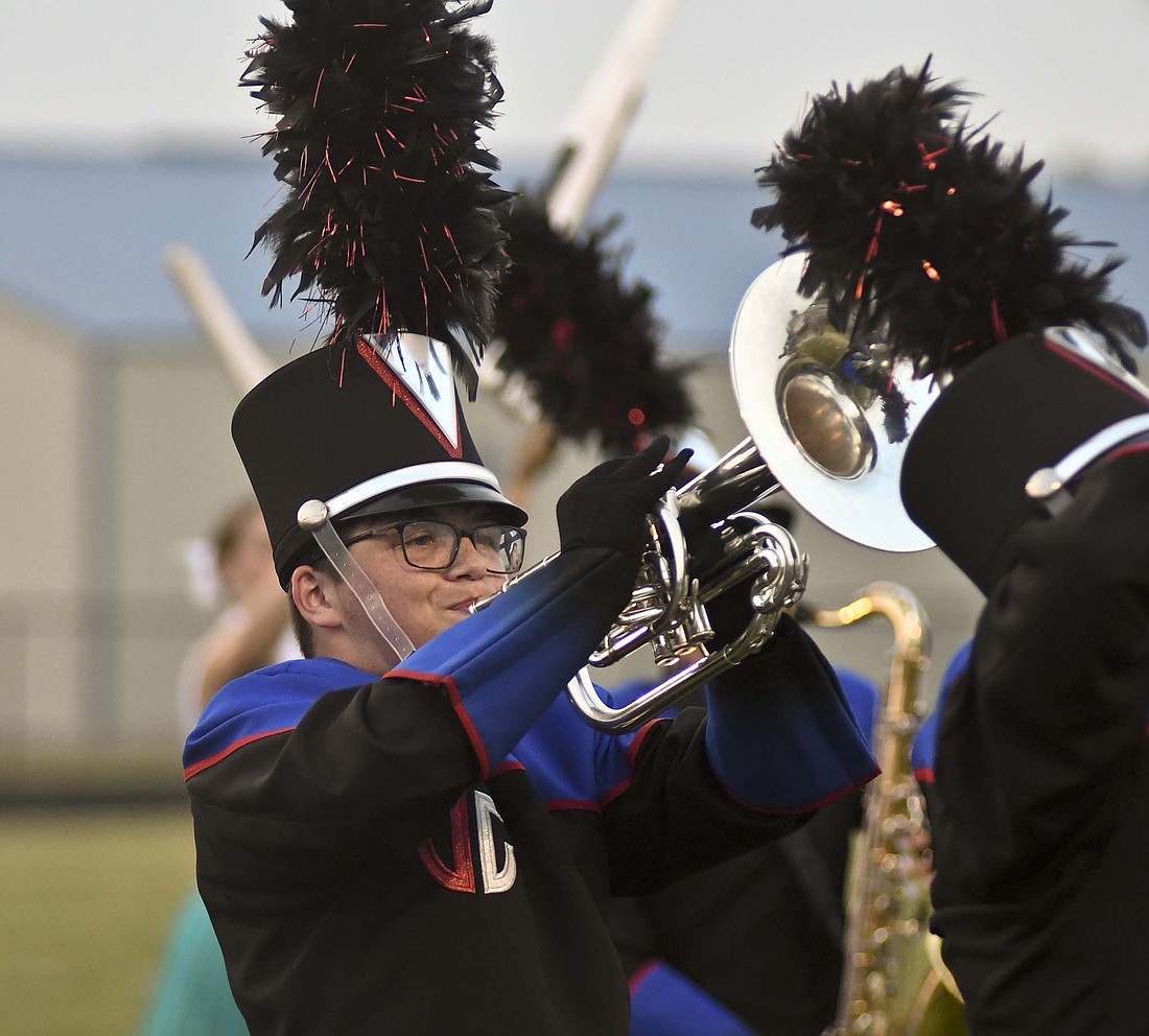 Thomas Charles, a 2023 Jay County High School graduate who served as the Marching PatriotsÕ drum major for the last two years, is back with the band this summer as a Òsuper senior.Ó He is one of seven of his classmates who chose to come back for an additional year, with two more assisting with the bandÕs giant flag prop. (The Commercial Review/Ray Cooney)