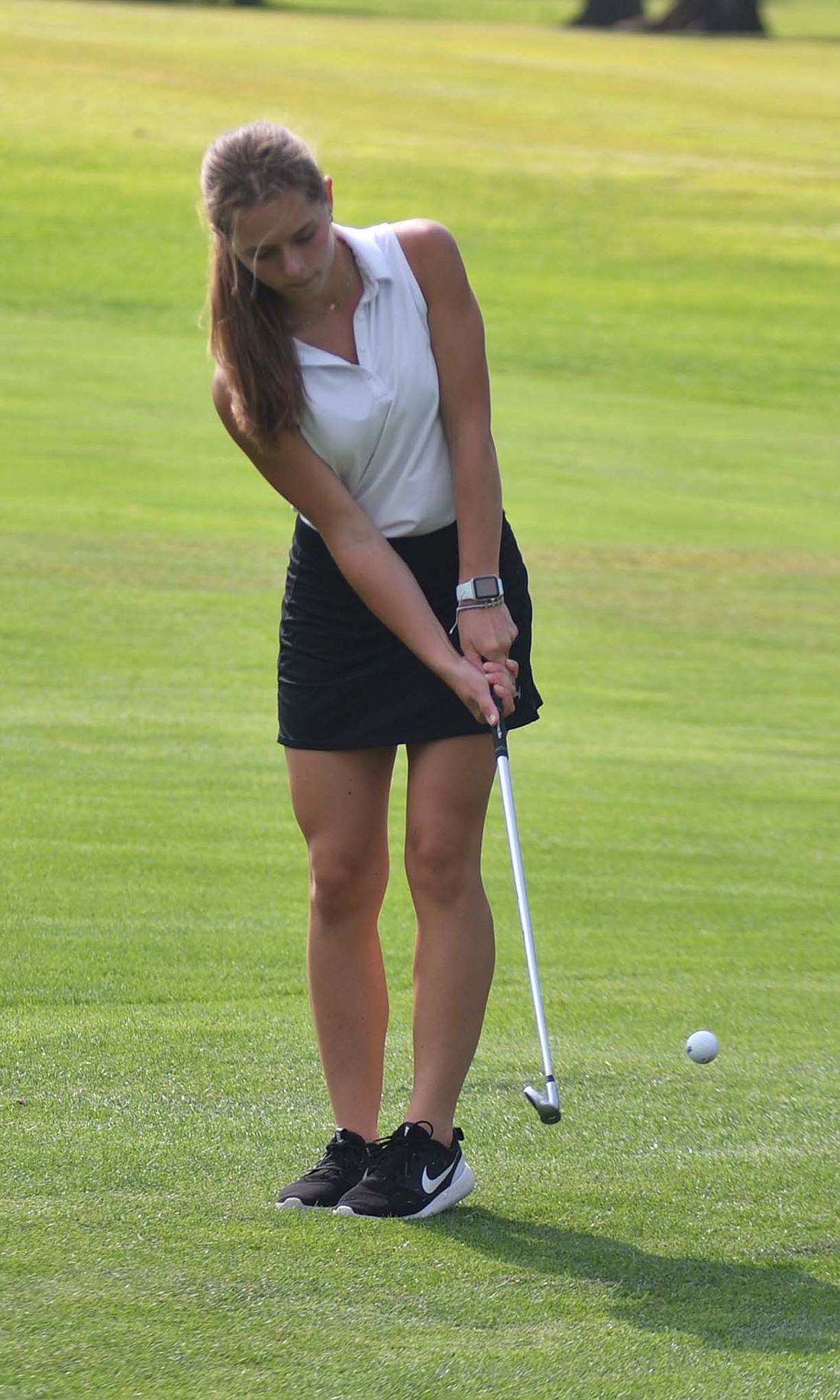 Fort Recovery High School junior Emma Will chips on the green of hole No. 4 at the Wabash Valley Golf Club during Tuesday's match against South Adams. Will finished with a score of 55 as the Indians fell to the Starfires 212-222. (The Commercial Review/Andrew Balko)