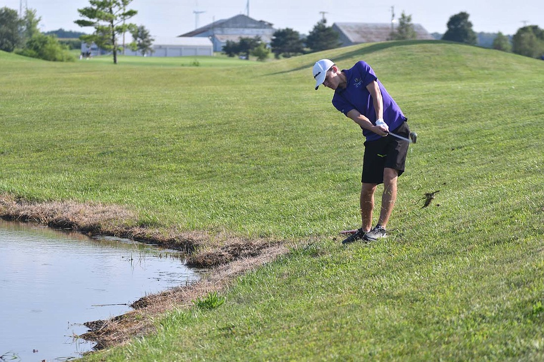 FRHS senior Nate Jutte hits his ball up a slope on Pony hole No. 6 at Winchester Golf Club during the Indians' 162-165 loss against Mississinawa Valley on Thursday. Jutte sent his first ball into the water before being forced to take a drop on the slope but was able to quickly reach the green and save the hole for a bogey. (The Commercial Review/Andrew Balko).