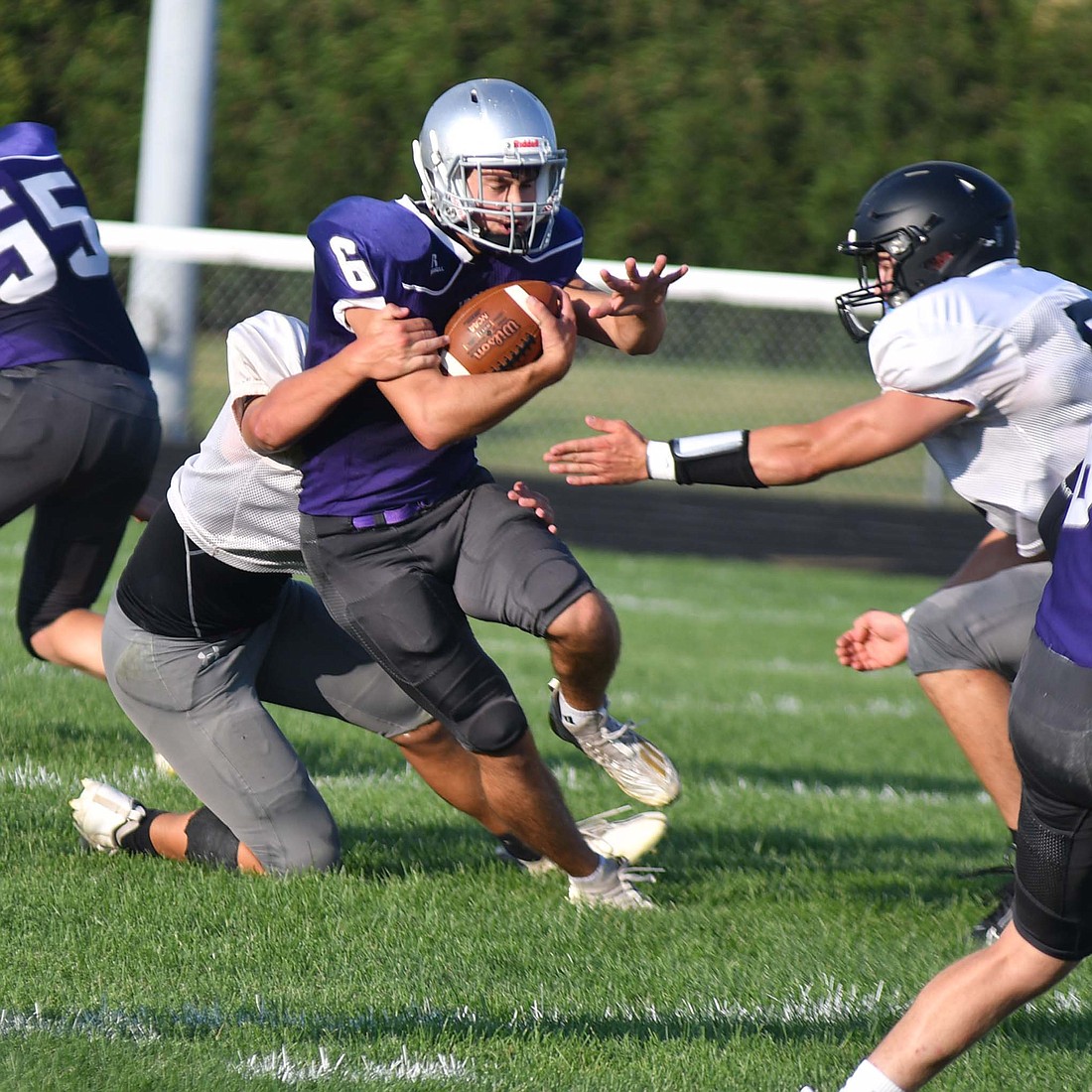 Troy Homan breaks a tackle during the Fort Recovery High School football teamÕs scrimmage on Friday night. (The Commercial Review/Andrew Balko)