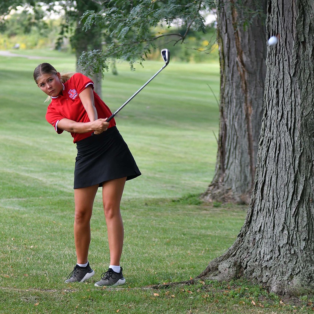 JCHS junior Maddy Snow hits her ball on the first hole at Portland Golf Club during the Patriots' three-way match with Bluffton and Monroe Central on Monday. Snow finished with 45 strokes to lead the Patriots to second in the match and earn match medalist honors. (The Commercial Review/Andrew Balko)