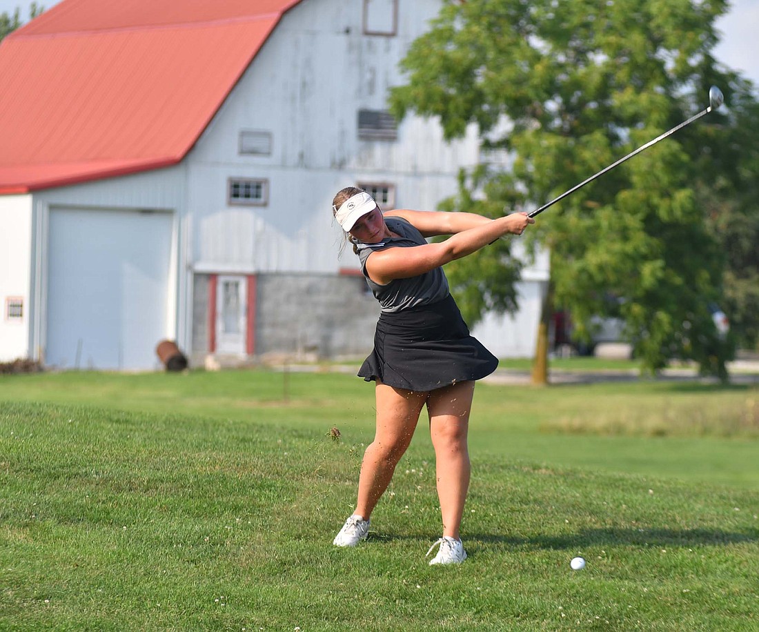 Sophomore Olivia Knapke hits her iron on hole No. 14 at Portland Golf Club during the Fort Recovery High School's match against St. John's. The Indians took down the Blue Jays for their first win of the season. (The Commercial Review/Andrew Balko)