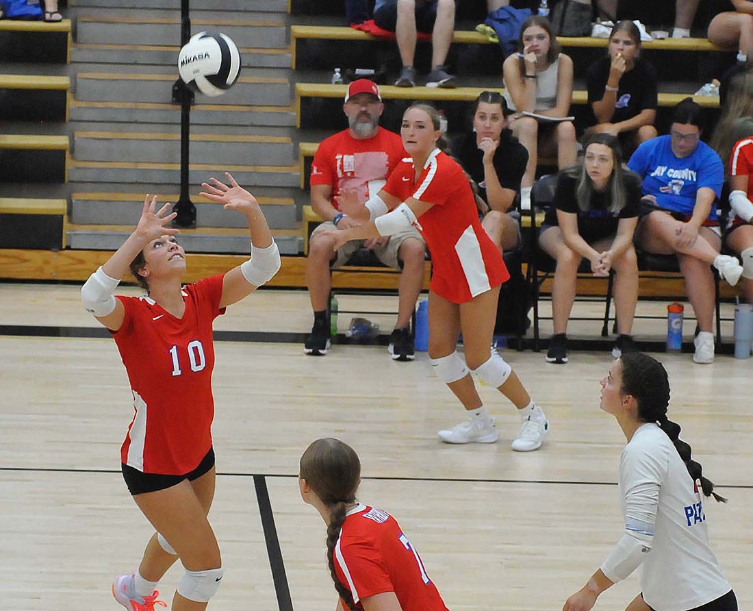 Sophie Saxman, a senior at Jay County High School, sets a ball during the Patirots three-set sweep of Winchester on Tuesday. (The Commercial Review/Rick Reed)