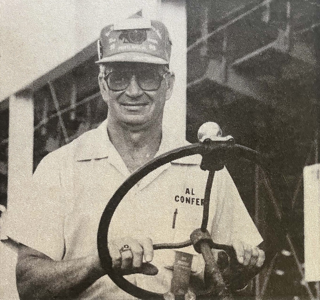 Tri-State Gas Engine and Tractor Association vice president Al Confer drives one of his Farmall tractors around Jay County Fairgrounds in 1998. (The Commercial Review/Laurie Chen)