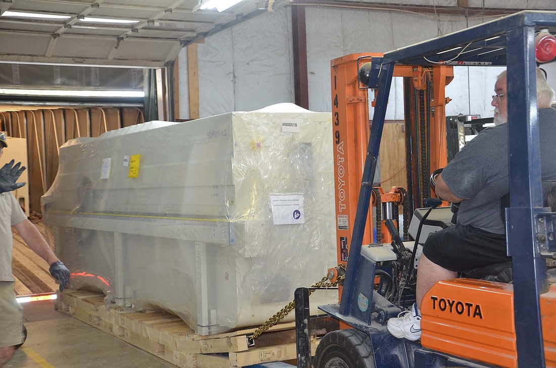 A new edge-bander was delivered to Pennville Custom Cabinetry on Aug. 17. The machine is part of an investment that will enable the company to produce modern as well as traditional cabinet styles. (Photo provided)