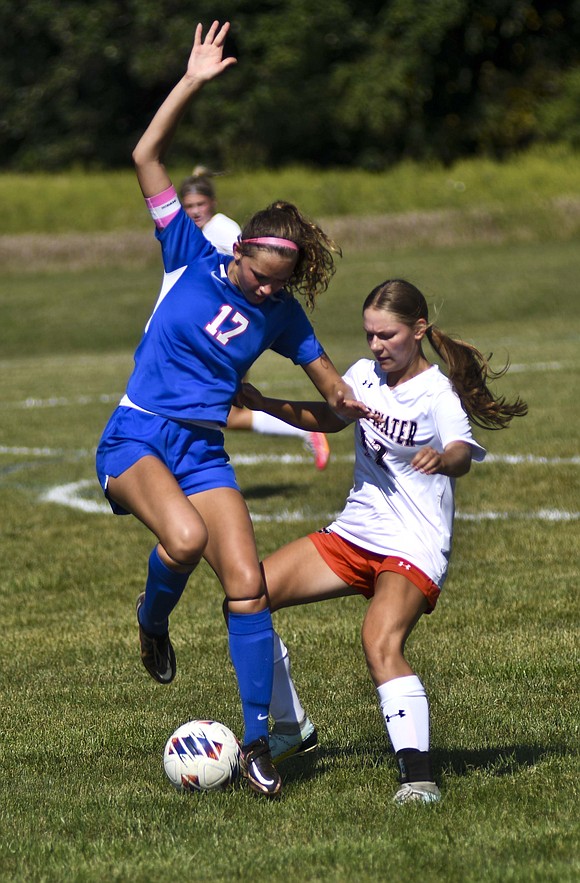 Jay County High School senior Molly Muhlenkamp battles for the ball with sophomore Kiersten Keller of Coldwater. (The Commercial Review/Ray Cooney)