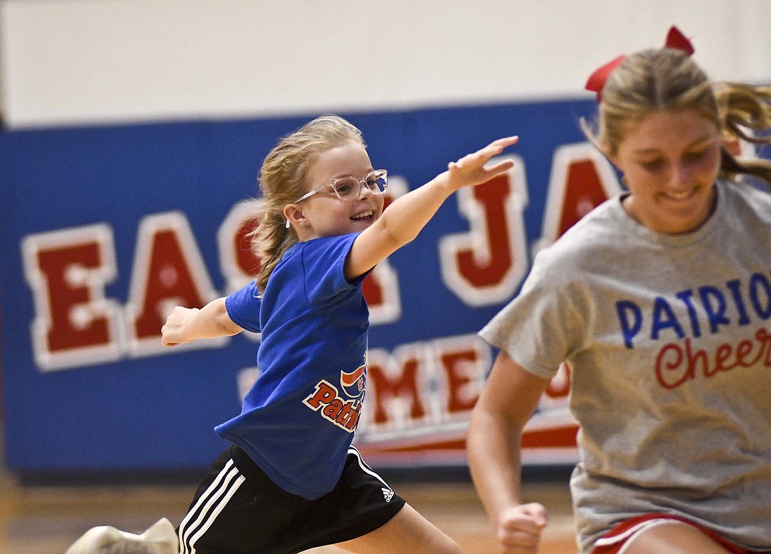 The Jay County High School cheerleaders held their annual clinic for kindergarten through sixth graders Tuesday and Wednesday. Pictured above, Maci Homan tries to chase down Patriot sophomore Faith Faulkner during a game of duck, duck, goose. Participants in the clinic will join the high school cheerleaders on the sideline during halftime of Friday’s football game against Adams Central. (The Commercial Review/Ray Cooney)