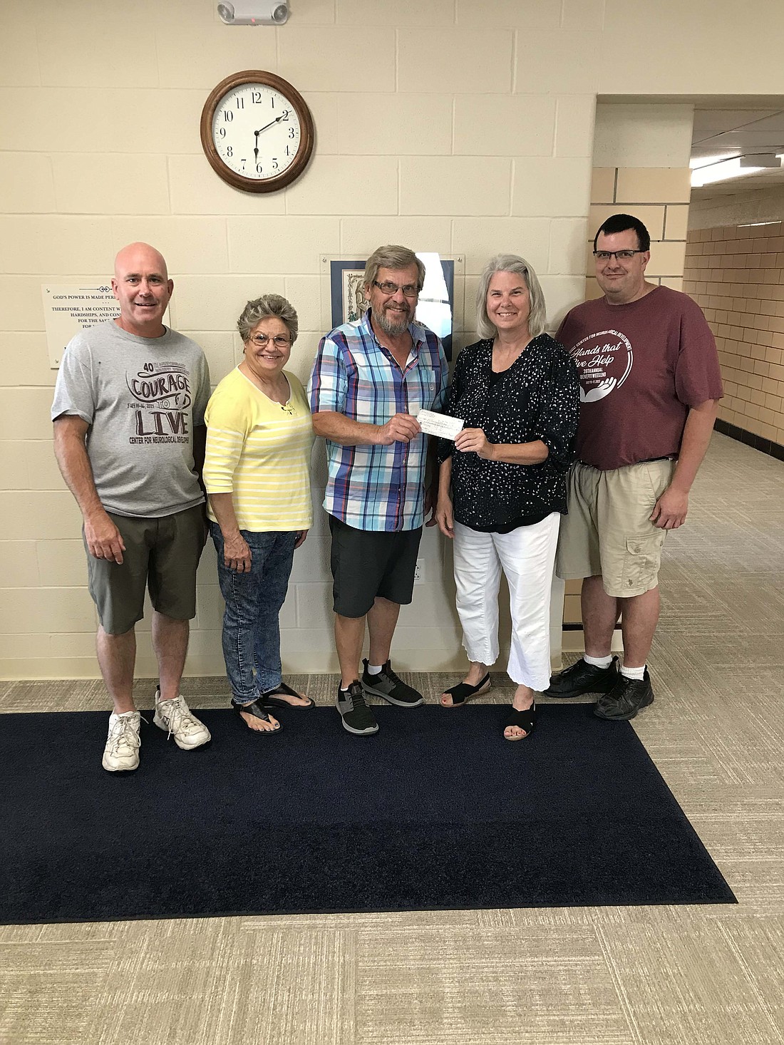 Wendelin Sports Club donated $27,321 to the Center for Neurological Development in Burkettsville, Ohio. The club raised the funds with a motorcycle poker run and raffle for a Harley Davidson Street Glide in July, drawing 24 motorcycles, or 58 people, in for the event. (Photo provided)