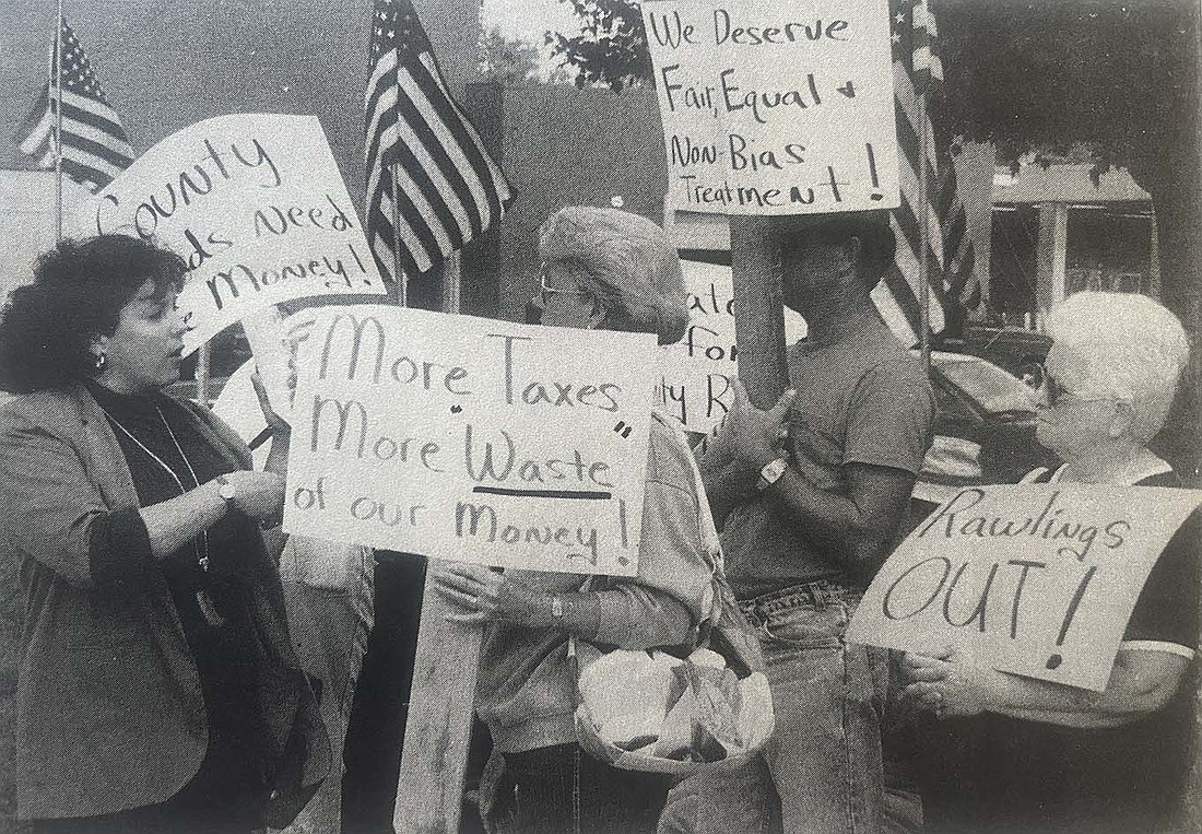 Vicky Lochtefeld (left) talks to other demonstrators outside Jay County Courthouse on Sept. 7, 1993. They were protesting the conditions of the county’s rural roads and later attended the Jay County Commissioners meeting to voice their concerns. (The Commercial Review/Jack Ronald)