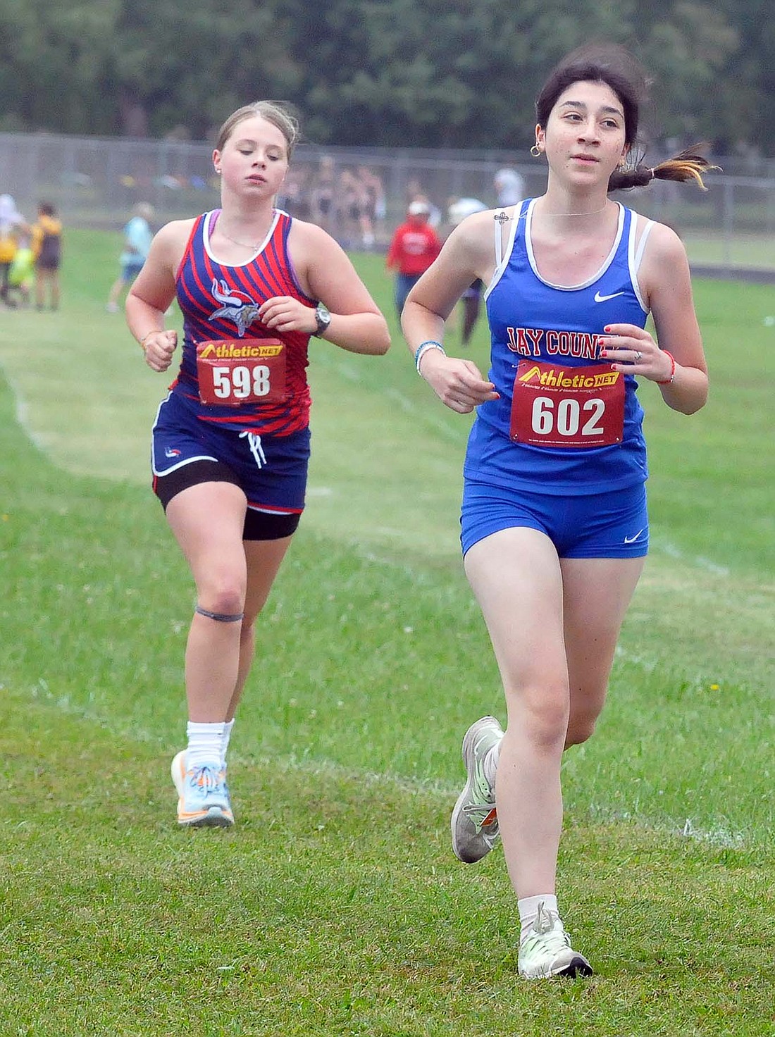 Jay County's Tina Japaridize competes with her Jay County teammates Saturday at the Randolph Southern Invitational. The Patriot girls' team finished sixth overall. (The Commercial Review/Rick Reed)