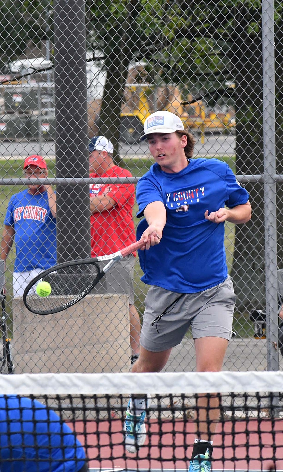 Jay County High School's Sam Myers hits a shot from the backline during the Patriots' No. 1 singles match on Monday against the Blackford Bruins. Myers and Gage Sims took down the Bruins' duo 6-0, 6-1 en route to a 5-0 sweep. (The Commercial Review/Andrew Balko)