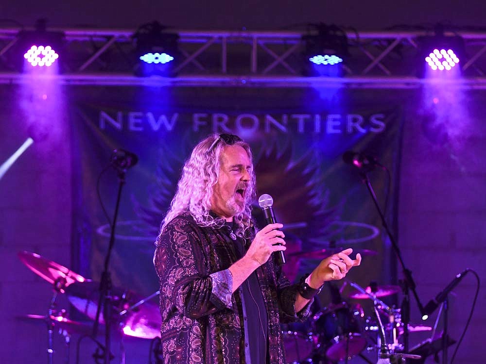New Frontiers performed Thursday night for the Arts Place concert series at the Hudson Family Park amphitheater in Portland. The Journey tribute band from Lima, Ohio, drew a crowd of more than 500. (The Commercial Review/Ray Cooney)