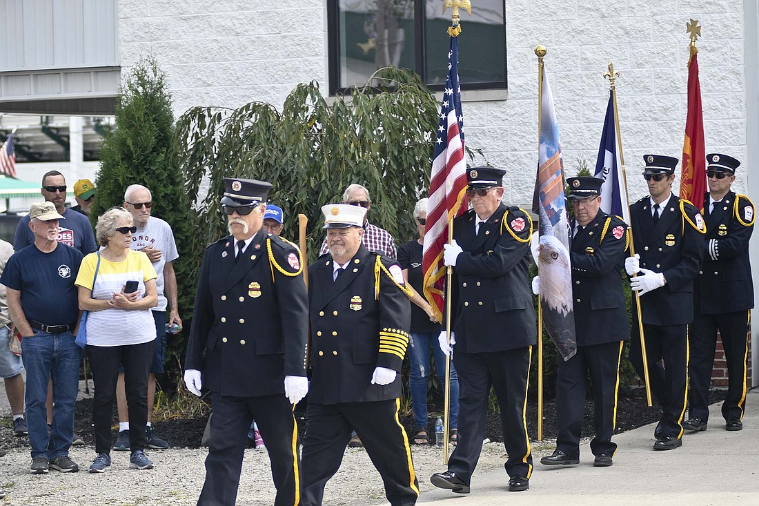 The Mercer County Fireman’s Honor Guard marches into place Sunday during closing ceremonies for the 9/11 NEVER FORGET Mobile Exhibit at Jay County Fairgrounds. The exhibit was on display Friday through Sunday. (The Commercial Review/Ray Cooney)