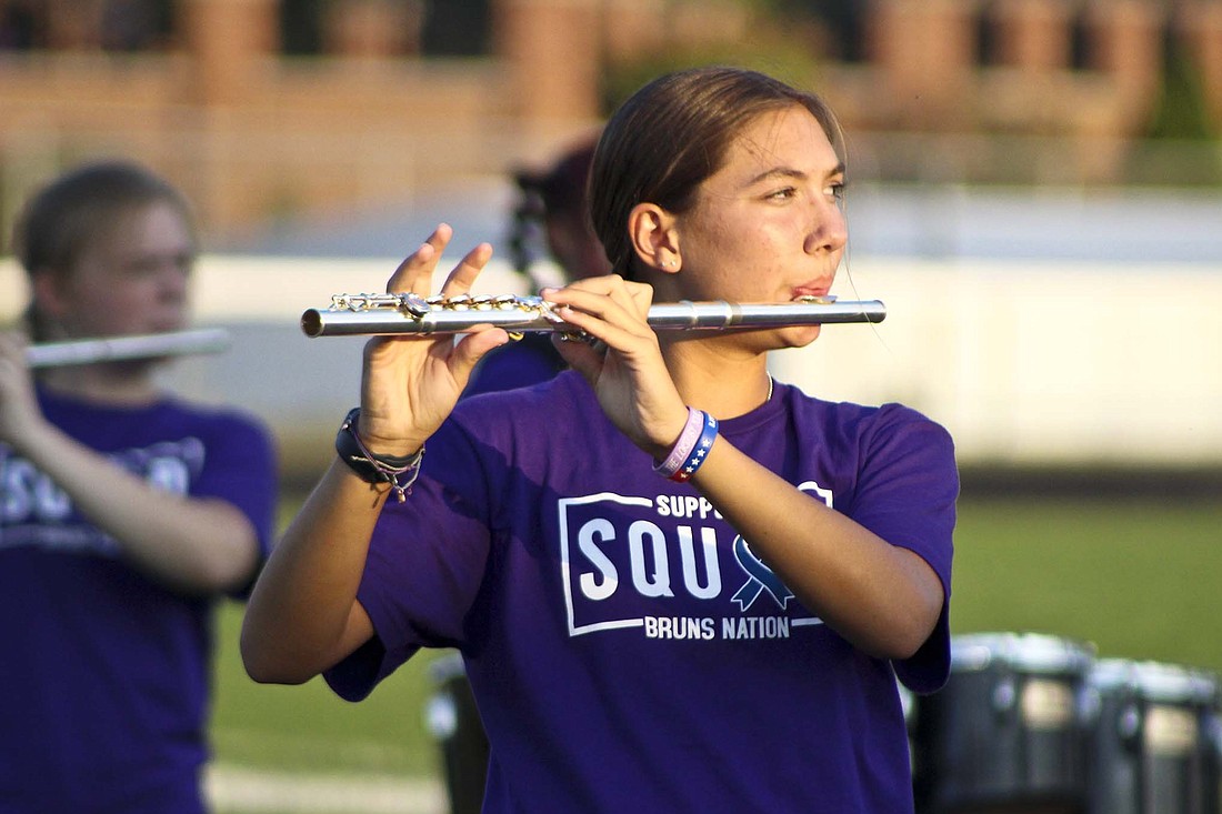 Kendall Ranly plays the flute while performing with the Fort Recovery High School marching band prior to Friday’s homecoming game against the New Bremen Cardinals. The Indians will be back at home this week to take on Division VII No. 1 Marion Local. (The Commercial Review/Bailey Cline)