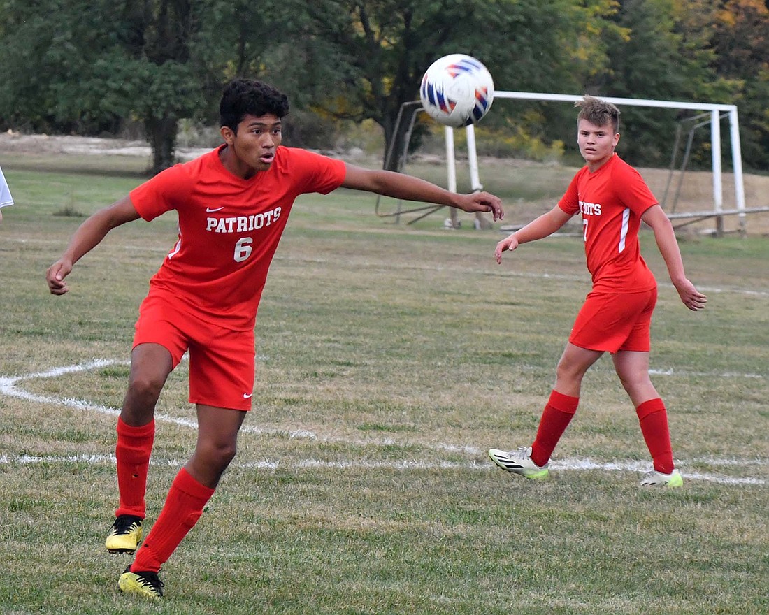 Jay County High School's Dylan Marentes (6) prepares to control the ball near the midfield line during the Patriots' 8-0 win over Blackford on Tuesday. After he controlled the ball, he turned upfield and passed to Levi Muhlenkamp (7) to score the first goal of the game. (The Commercial Review/Andrew Balko)