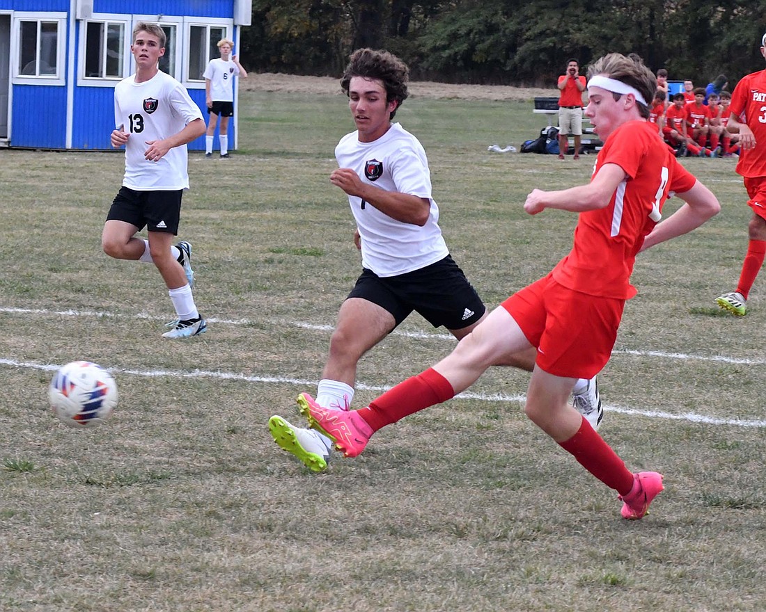 Jay County High School’s Brayden Collins takes a shot to score a goal during the Patriots’ 8-0 over Blackford on Tuesday. Collins’ score came with 21:10 left in the first half, when he dribbled the ball all the way from the midfield on a fastbreak. (The Commercial Review/Andrew Balko)