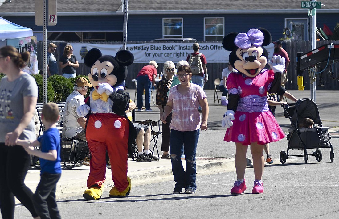 Mickey and Minnie Mouse arrive Saturday to greet visitors to Glass Days. The festival made its return to Dunkirk with a variety of activities after it had been on hiatus since 2019. (The Commercial Review/Ray Cooney)