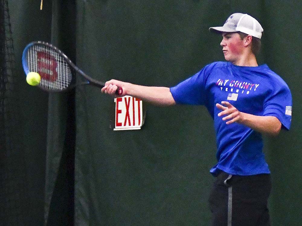 Jay County High School senior Abraham Dirksen connects on a shot during the individual boys tennis sectional championship match Thursday at YMCA of Muncie. Dirksen, who racked up a 20-5 record this year, fell 6-0, 6-0 to Alex Sagarra, a Westfield exchange student from Switzerland. (The Commercial Review/Andrew Balko)