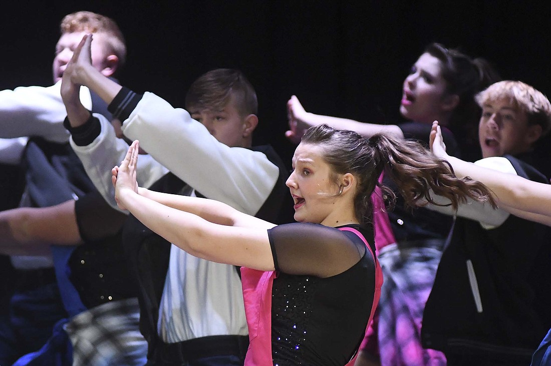 Ellie Darnell performs Sunday afternoon as part of the Patriot Edition show choir during the Jay County Junior/Senior High School choral department’s fall concert. The choir’s next concert — a Christmas concert in conjunction with the school’s band program — is scheduled for 2 p.m. Dec. 10. The JCHS show choirs start their competition season in January. (The Commercial Review/Ray Cooney)