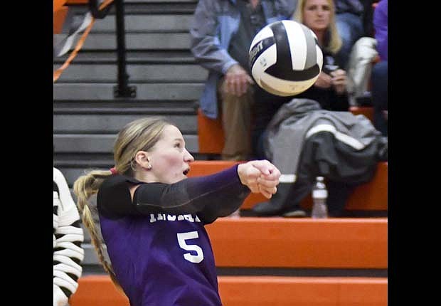 Fort Recovery High School senior Cali Wendel reacts quickly to dig out a hit from Ansonia late in the second set of the Indians' 25-12, 25-17, 25-16 win over the Tigers on Monday. Wendel finished with a team-high 10 digs while also contributing an ace and three assists. Fort Recovery totalled 32 digs. Kennedy Muhlenkamp was the only other Indian with more than five digs, tallying nine. (The Commercial Review/Andrew Balko)