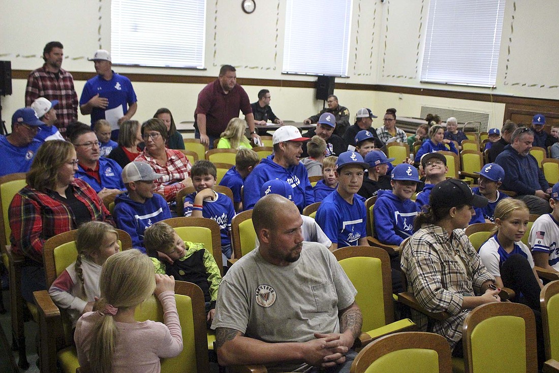 Members of Jay County Baseball Club filled about half of the seats in the Jay County Courthouse auditorium for Wednesday’s Jay County Council meeting. Council approved $220,000 in funding for the club’s project to establish The Clubhouse, an indoor training facility for turf sports. The funding will now move on to Jay County Commissioners for their approval. (The Commercial Review/Bailey Cline)