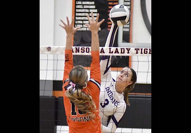 Saige Leuthold of Fort Recovery High School hits a ball near the middle of the net during Monday's win against Ansonia. Leuthold has been on a tear with 50 kills over the past 13 days while leading the Indians in blocks on the year with 55. (The Commercial Review/Andrew Balko)