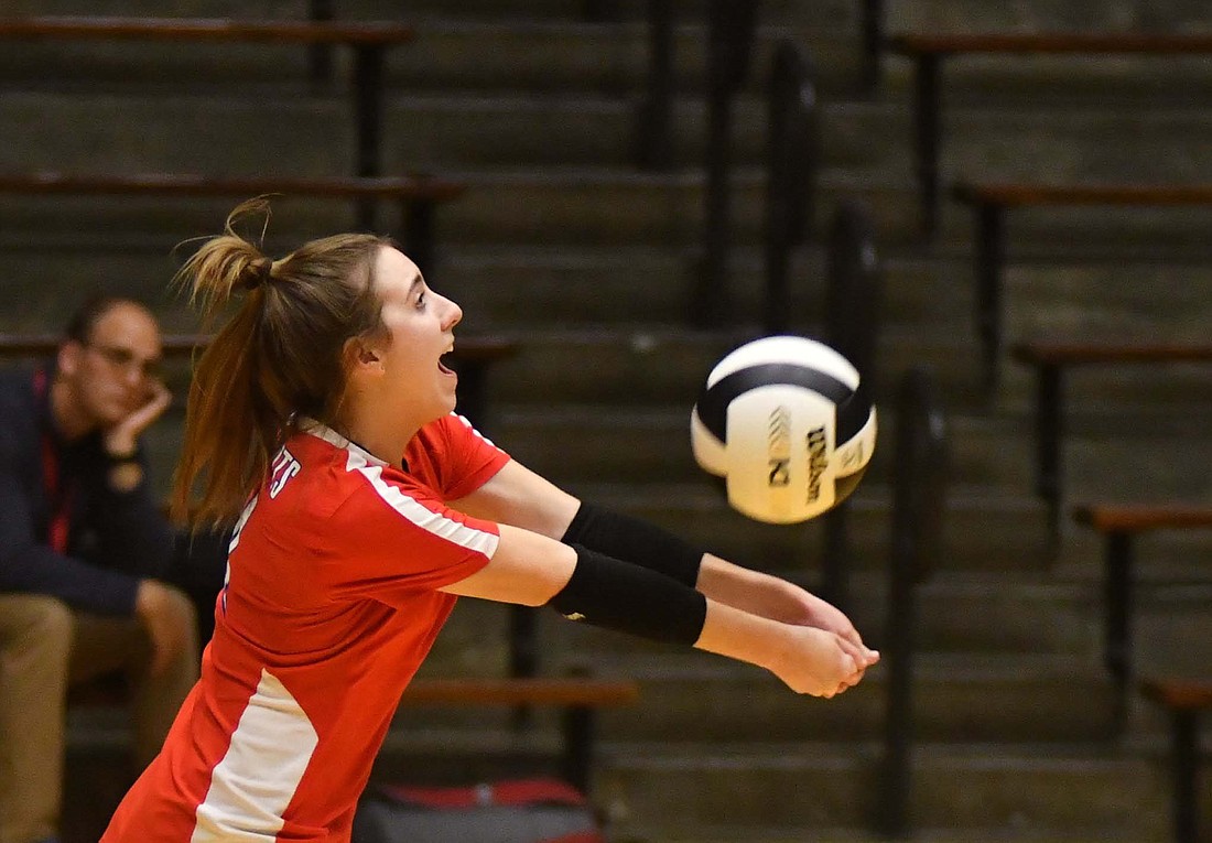 Brenna Bailey, a defensive specialist for the Jay County High School volleyball team, digs a ball out of the back row during the PatriotsÕ 25-12, 25-22, 25-22 win over Centerville in the sectional opener Thursday at New Castle. Bailey had two aces and seven service points in a strong performance behind the service line. (The Commercial Review/Andrew Balko)