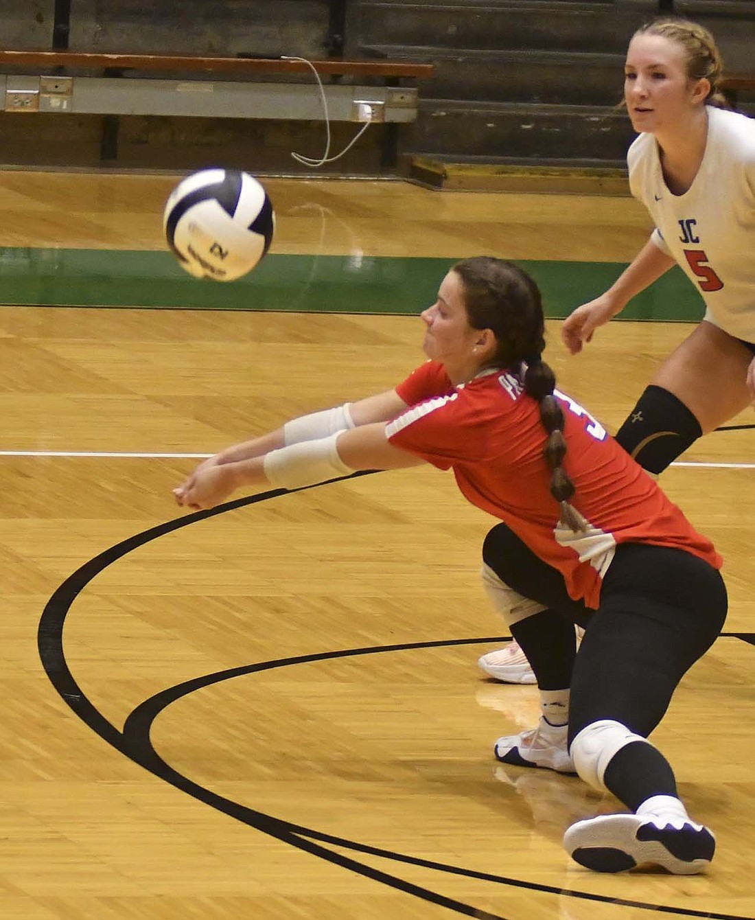 JCHS senior Brenna Haines digs out a ball during the IHSAA Class 3A Sectional 24 semifinal against Frankton on Saturday. Haines led the Patriots with 29 digs as they fell to Frankton 25-12, 25-23, 22-25, 25-17. (The Commercial Review/Andrew Balko)