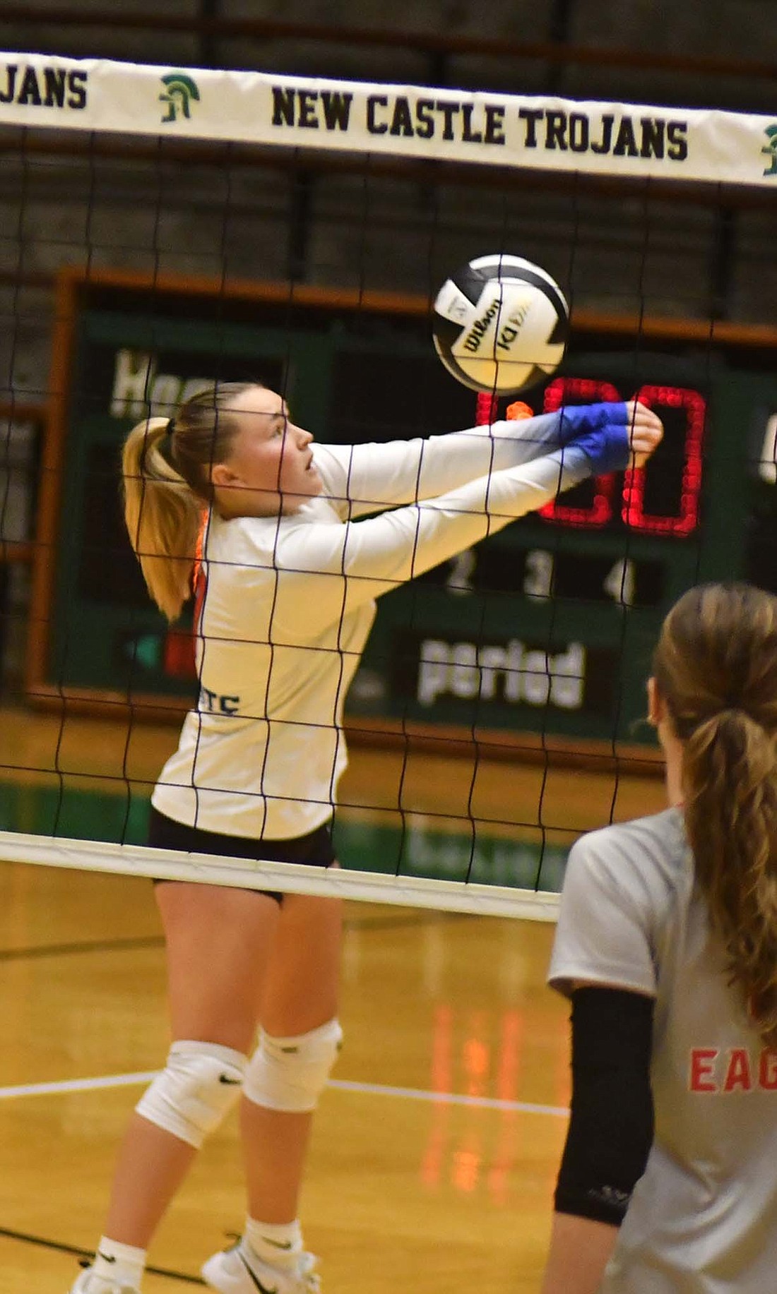 Jay County High School sophomore Lani Muhlenkamp passes the ball during the Patriots’ 25-12, 25-23, 22-25, 25-17 loss to the Frankton Eagles in the IHSAA Sectional 24 semifinal at New Castle on Saturday. Muhlenkamp played on the back row for Jay County, where she had 13 digs. Muhlenkamp also was perfect when serving in the match, going 10-for-10 without committing a service error and tallying four service points. (The Commercial Review/Andrew Balko)