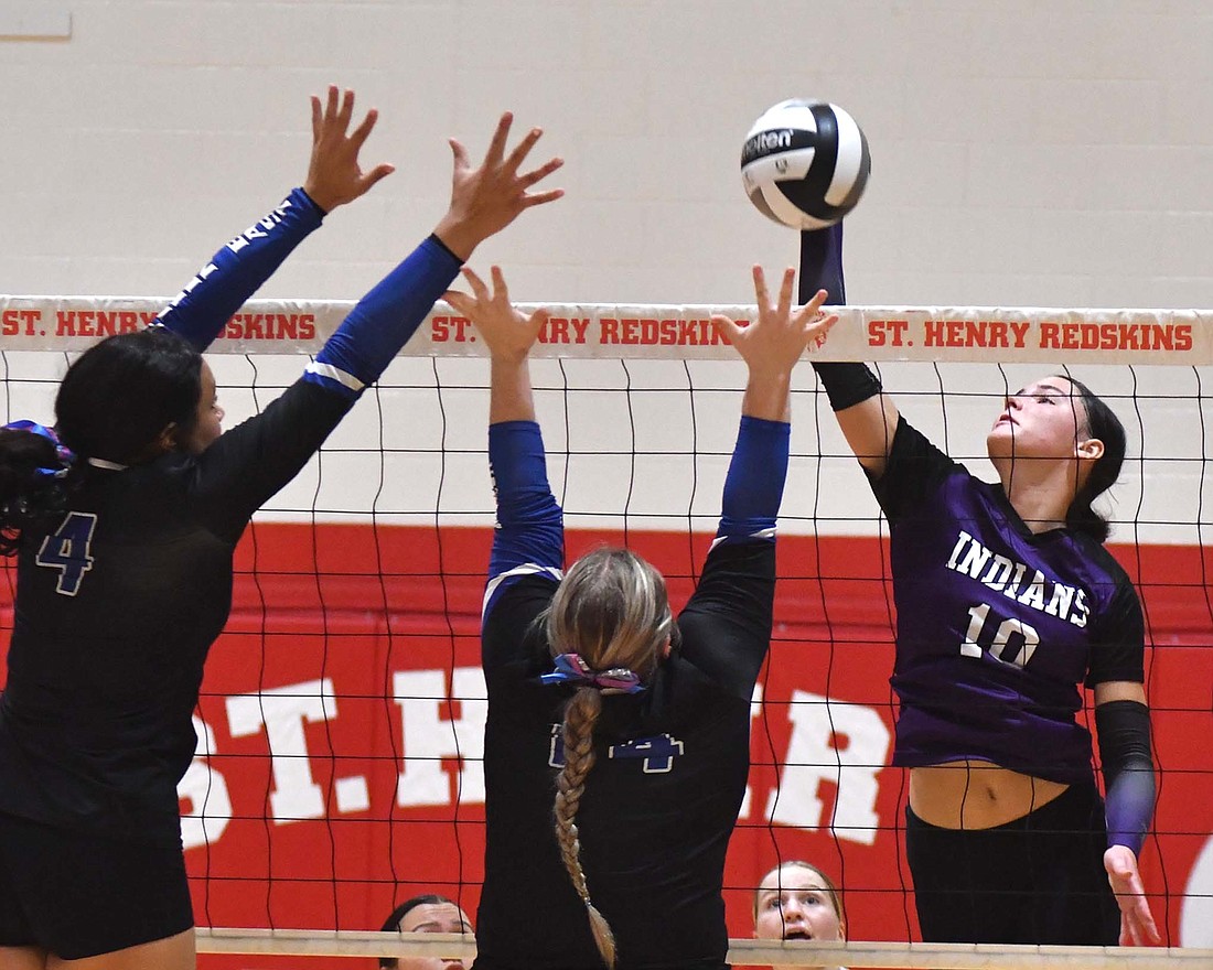 Teigan Fortkamp of FRHS attacks a ball at the net on Thursday in as the Indians took down Allen East in the sectional championship. Fortkamp led all hitters with 16 kills in the match, while also playing well on the back row with 15 serve receptions without an error. (The Commercial Review/Andrew Balko)