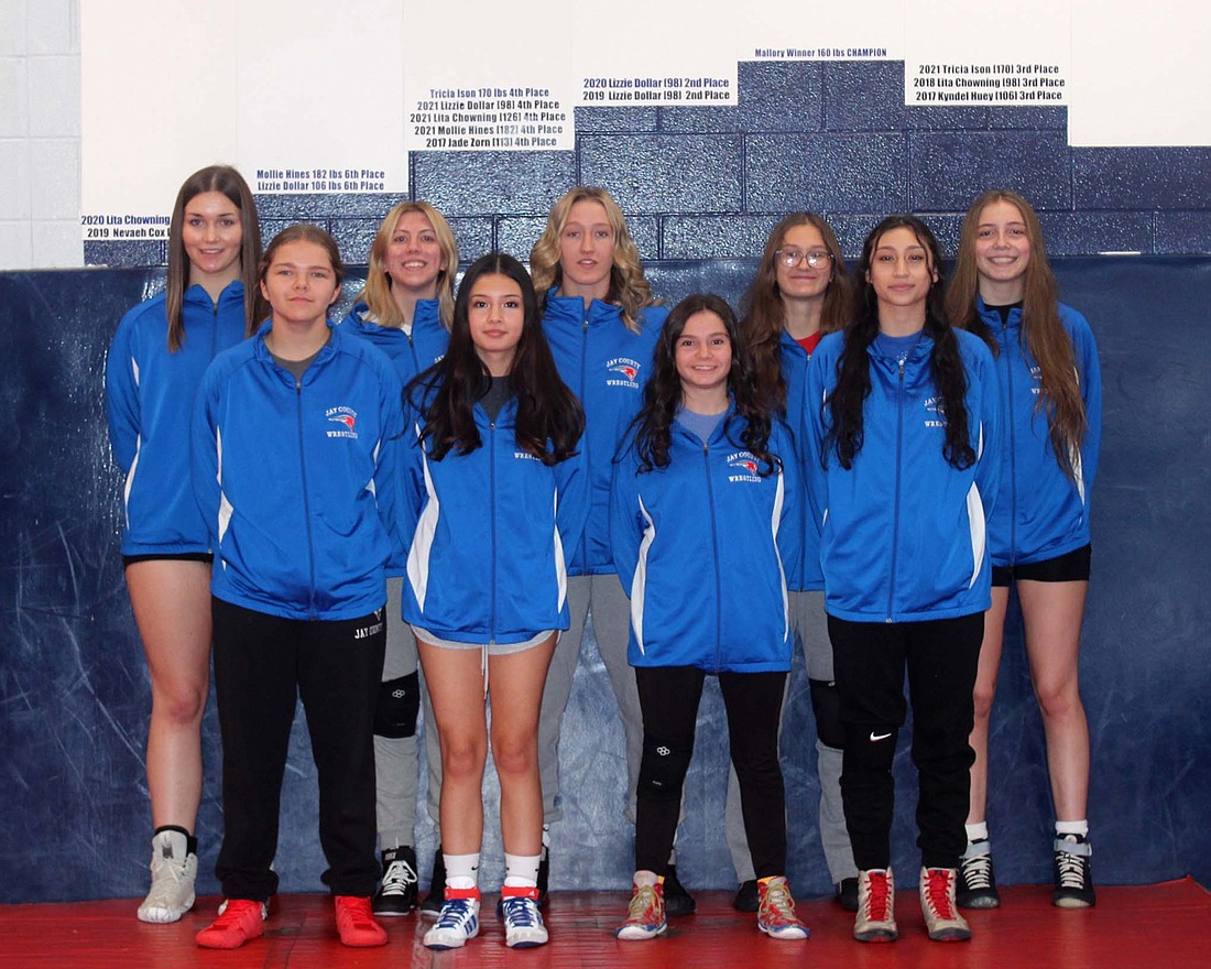 Pictured is the 2023-24 Jay County High School girls wrestling team. Front row from left are Maleah Parsons, Sophie Thomas, Katie Rowles and Tatianna Willis. Back row are Kiley Williams, Lina Lingo, Mallory Winner, Willow Hardy, and Emily Manor. Not pictured are Alexis Hitchfiel, Tessa Miller, Haley Ridenour, Allison Tipton and Ellie Wendel. (The Commercial Review/Andrew Balko)