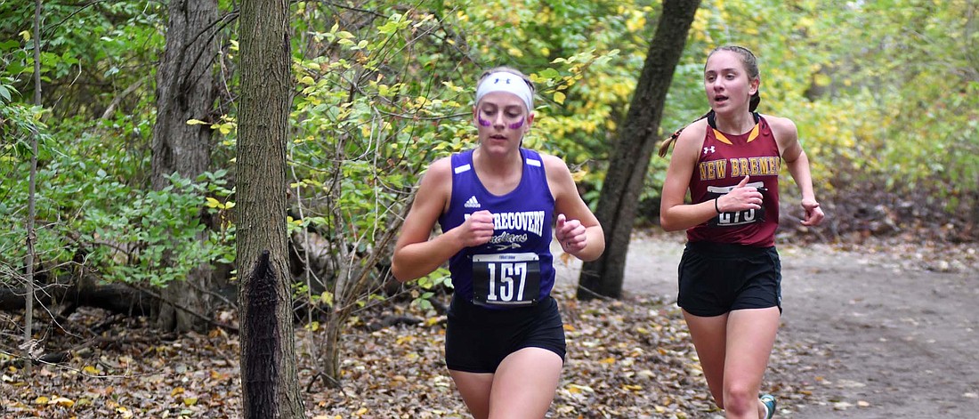 Jenna Hart, a senior at Fort Recovery High School, comes out of the final stretch in the woods during the district meet at Columbus grove on Oct. 21. Hart will get the opportunity to compete at state for the fourth time and is planning on leaving everything out on the the course. (The Commercial Review/Andrew Balko)