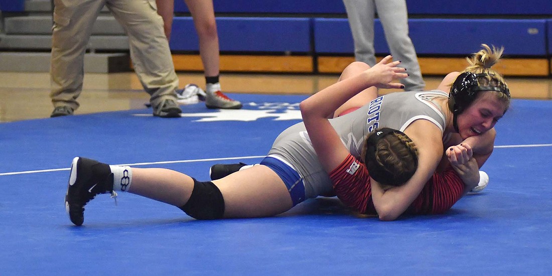 JCHS junior Lina Lingo pins Blackford’s Sara Yoho with a half nelson during the Patriots’ season opener on Thursday. Lingo won both of her matches, also pinning Lindsey Pugh of North Miami in the second period. (The Commercial Review/Andrew Balko)