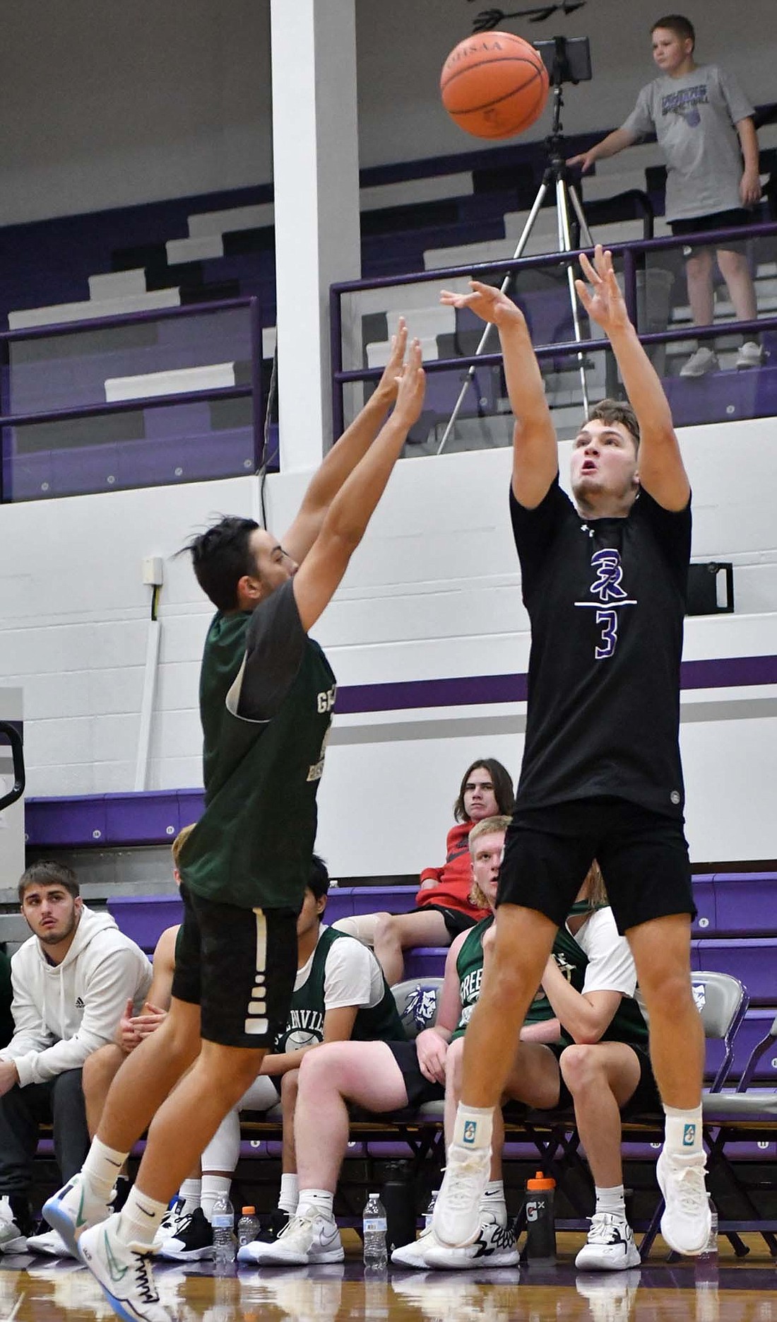 Fort Recovery High School senior Reece Guggenbiller releases a three pointer from the left corner during the Indians’ scrimmage against Greenville on Monday. Fort Recovery will open its season on Dec. 2 when it hosts the Jay County Patriots. (The Commercial Review/Andrew Balko)