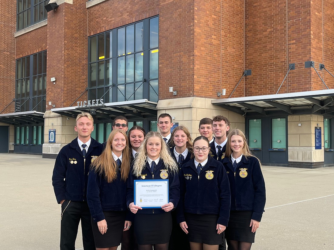 Seven Jay County graduates earned their American FFA Degrees Nov. 4 at the National FFA Convention in Indianapolis, including Emily Chenoweth (pictured in center surrounded by other FFA members). The award is the highest degree the FFA organization can bestow on a member, and less than 1% of the FFA members attain it. (Photo provided)