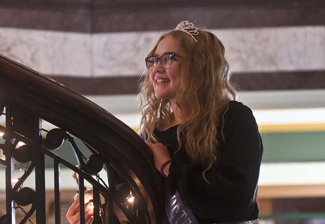 Little Miss Winterfest 2022 Aria Barnett grins as she flips the switch to light the Christmas tree Friday evening at Jay County Courthouse. The tree lighting kicked off Winterfest activities, which continue today with the Kids Breakfast and Karnival from 8:30 to 11 a.m. at East Jay Elementary School, the Little Miss Winterfest Pageant at 2 p.m. at Fellowship Baptist Church and the Parade of Lights at 6:30 p.m. in downtown Portland. (The Commercial Review/Ray Cooney)