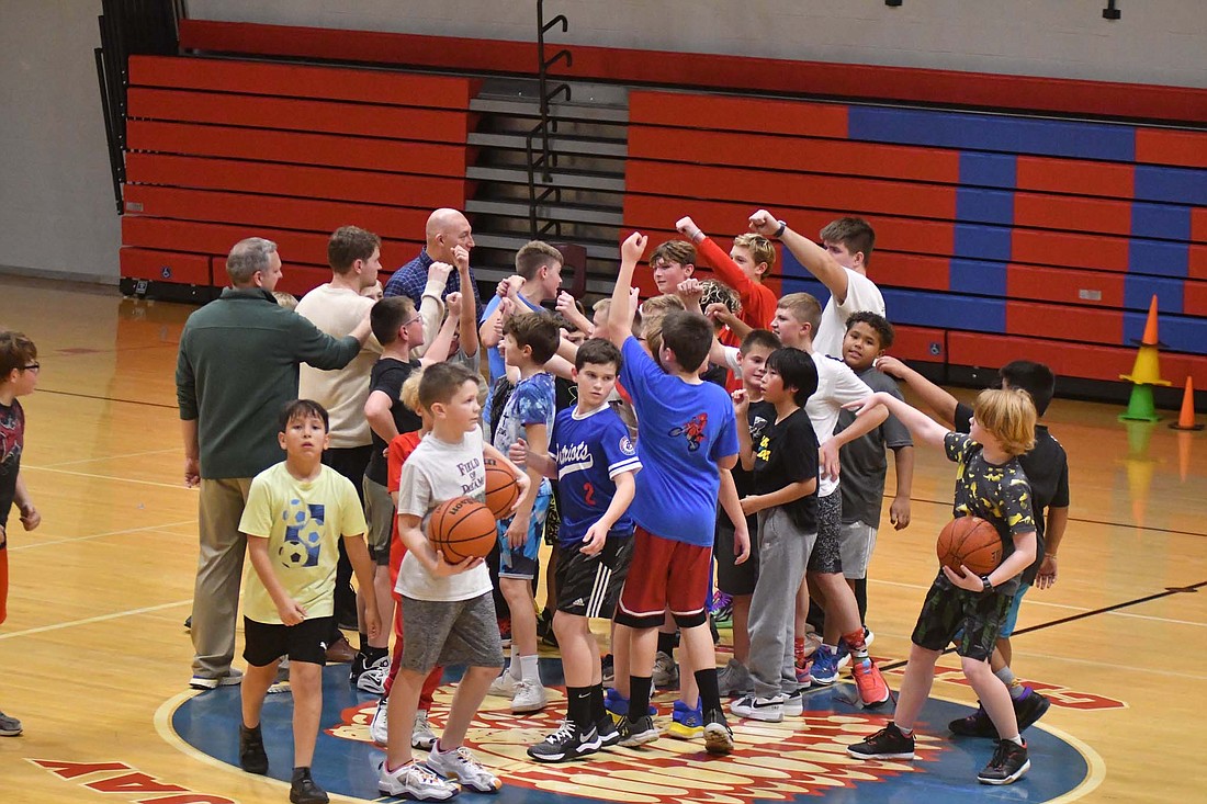 Students and coaches come in for a breakdown at the end practice at East Jay Middle School on Nov. 16. This is the inagural year for the Jay County Elementary Schools basketball program where students from East Jay and Bloomfield come together while Redkey and West Jay meet to develop skills and foster competition. (The Commercial Review/Andrew Balko)