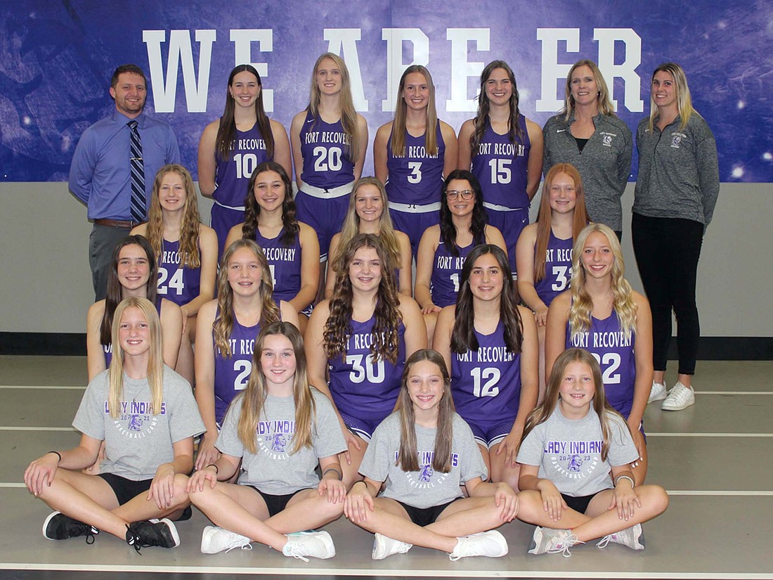 Pictured is the 2023-24 Fort Recovery High School girls basketball team. Front row from left are managers Ellie Niekamp, Rielle Wendel, Rayla Staugler and Leah Willmann. Second row is Cameron Muhlenkamp, Emma Schmitz, Ivy Tobe, Madie Schoenlein and Makenna Huelskamp. Third row is Brynn Willmann, Sophia Guggenbiller, Cali Wendel, Kensey Gaerke, Cadence Eber. Back row are coach Tyler Deitsch, Saige Leuthold, Kennedy Muhlenkamp, Karlie Neikamp, Bridget Homan, assistant coach Mandy Gerlach and assistant coach Val Muhlenkamp. (The Commercial Review/Andrew Balko)