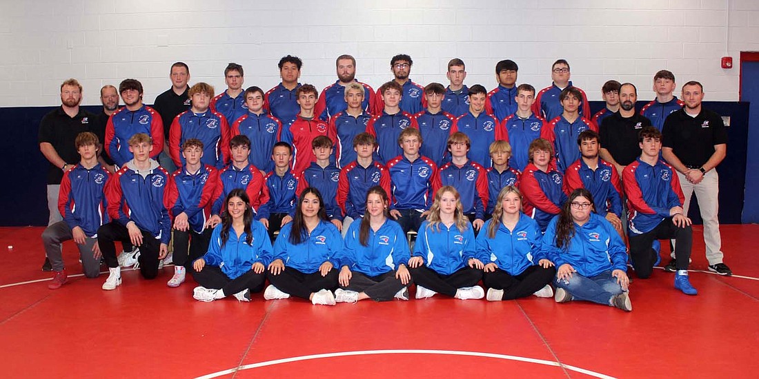 Picutred is the 2023-24 Jay County High School boys wrestling team. Front row from left are managers Chloe Ruiz, Alex Bravo, Lucie Henneaux, Trinity Glassford, Emmarie Barton and Taylee Nichols. Second row are Brayden Fox, Cole Carpenter, Griffin Byrum, Cody Rowles, Hayden Richman, Sylas Wenk, Gabe Ardizzone, Hayden Ison, Gaven Hambrock, Grant Linville, Garrett Bennett, Joaquin Johnson and Landon Mills-Blowers. Third row are Assistant coach Bradley Rosman, Bryce Wenk, Brayden Romine, Mario Ardizzone, Jason Landers, Tony Wood, Jacob Robinson, Cooper Glassford, Trace Smith, AJ Heskett, Taye Curtis, Leighton Brown, coach Eric Myers, and assistant coach Tyler Leonhard. Back row are assitant coach Bruce Wood, assistant coach Nick .Leonhard, Cameron Clark, Alan Ortiz, Conner Specht, Juaquin Flores, Cody Gibson Reynaldo Ortega-Leos, Jason Linn and Brice Coy. Not pictured are Carson busick and Alejandro Ruiz. (The Commercial Review/Andrew Balko)