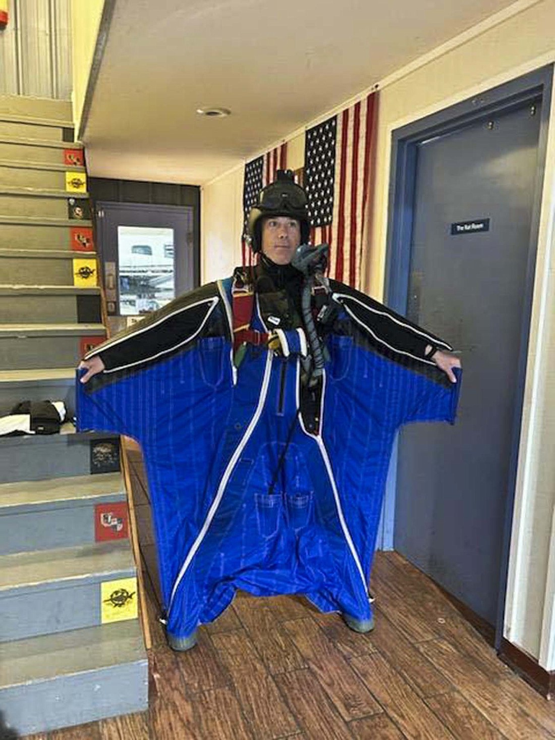 Aaron Smith shows off his wingsuit on July 1, 2023 before he gets on the plane for his jump. Smith, a Jay County native, set the world record for the highest altitude wingsuit jump at 433,253.6 feet in Whiteville Tennessee. (Photo provided)