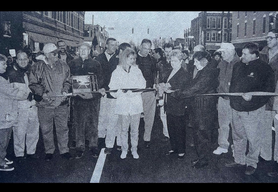 Portland Mayor Maxine Lewis cuts a ceremonial ribbon on Meridian Street on Nov. 21, 1998, to dedicate the $8.4 million infrastructure improvement and beautification project. (The Commercial Review/Jack Ronald)